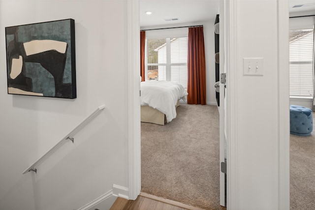 bedroom with light colored carpet