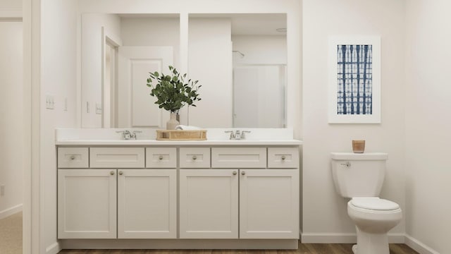 bathroom featuring a shower, vanity, and toilet