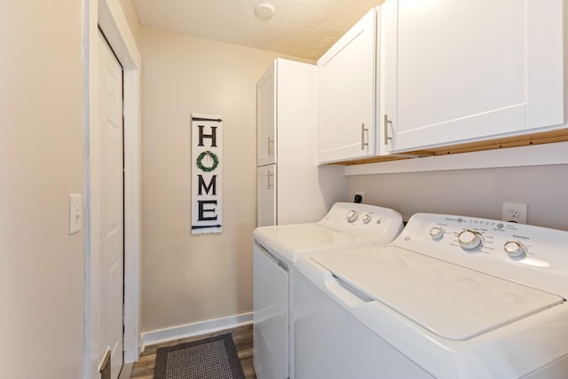 washroom featuring dark hardwood / wood-style floors, cabinets, independent washer and dryer, and a textured ceiling