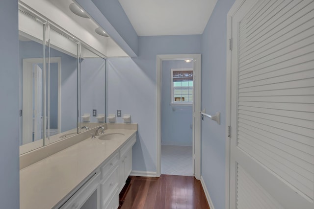 bathroom featuring vanity and hardwood / wood-style flooring