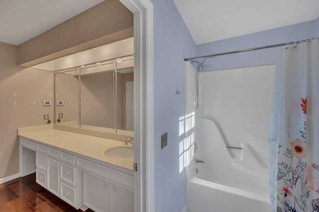 bathroom featuring wood-type flooring, vanity, and shower / tub combo with curtain