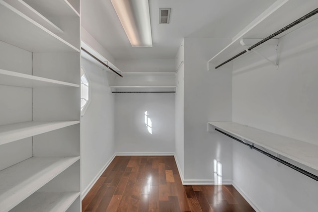 walk in closet featuring dark hardwood / wood-style flooring