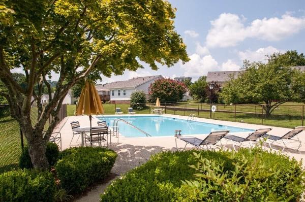 view of swimming pool with a yard and a patio