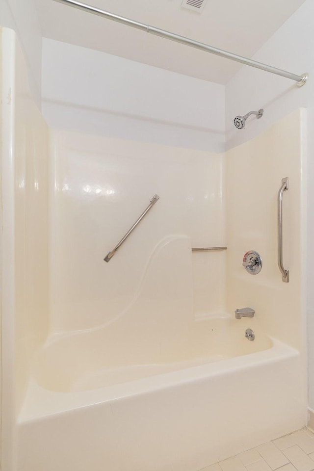 bathroom featuring bathtub / shower combination and tile patterned floors