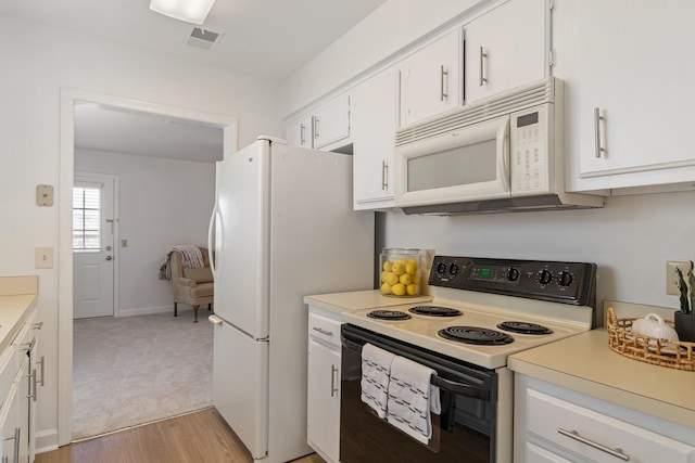 kitchen featuring white cabinets, white appliances, and light hardwood / wood-style floors