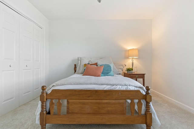 carpeted bedroom featuring a closet