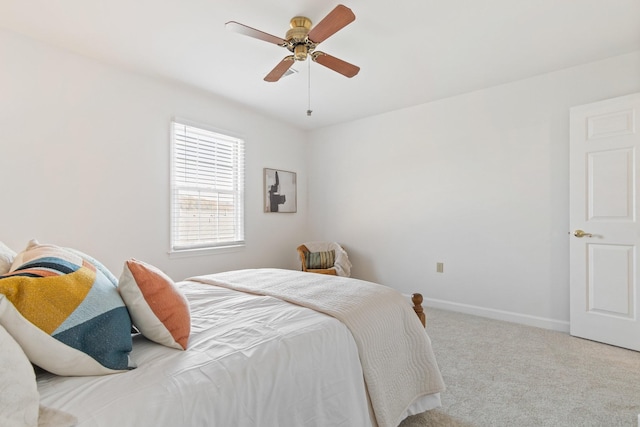 bedroom with light colored carpet and ceiling fan