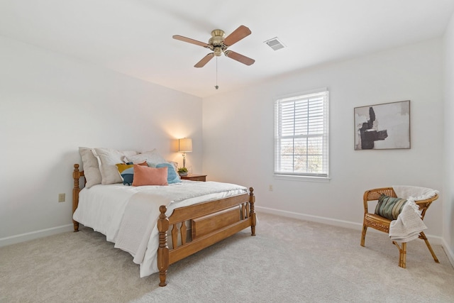 bedroom featuring ceiling fan and light carpet