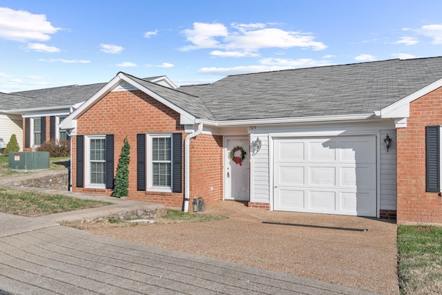 ranch-style house featuring a garage