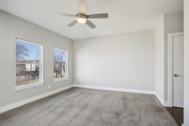 spare room featuring ceiling fan and carpet floors