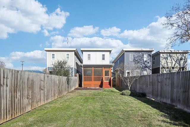 back of property featuring a lawn