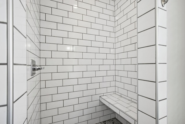 bathroom with tiled shower