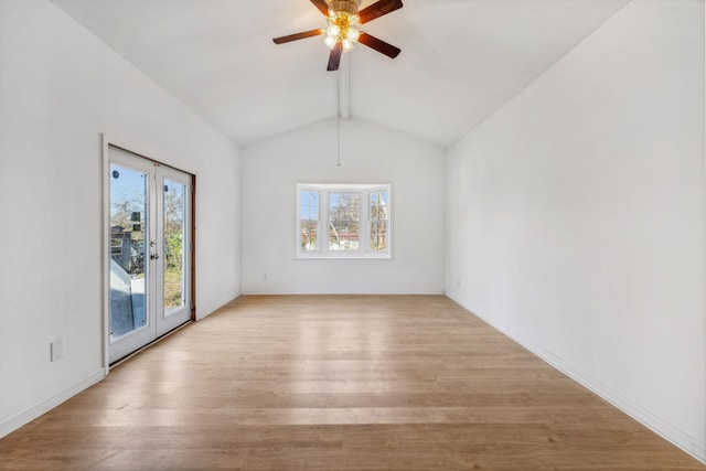 unfurnished room with french doors, vaulted ceiling with beams, light wood-type flooring, and ceiling fan