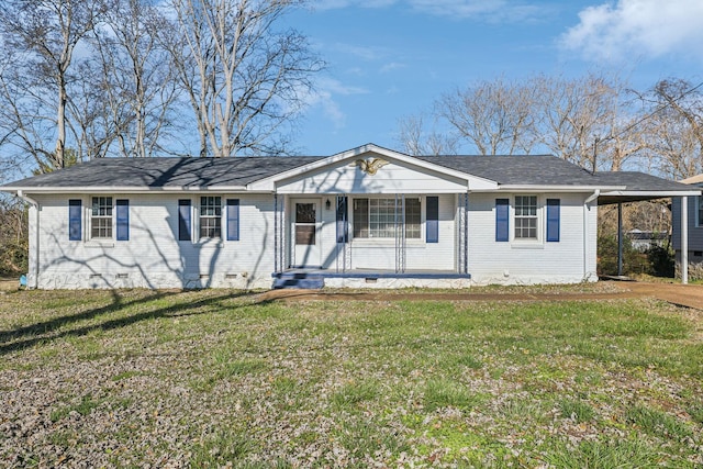 ranch-style home with covered porch and a front yard