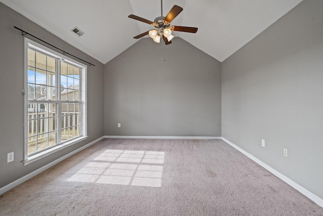 unfurnished room featuring ceiling fan, light colored carpet, and lofted ceiling