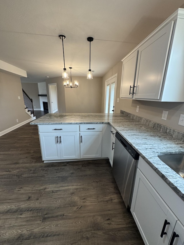 169 Anderson Pl, Clarksville, TN 37040 - kitchen with a peninsula, white cabinetry, dishwasher, dark wood-type flooring, and hanging light fixtures
