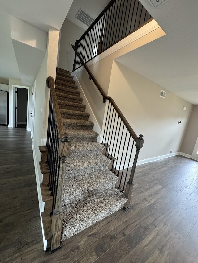 169 Anderson Pl, Clarksville, TN 37040 - stairway featuring baseboards, wood finished floors, and visible vents