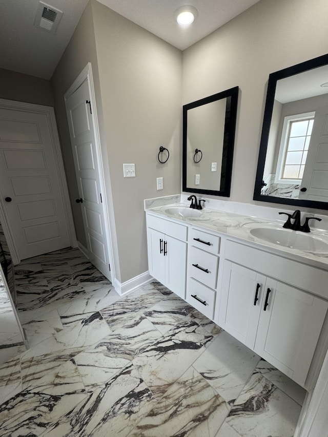 169 Anderson Pl, Clarksville, TN 37040 - bathroom with baseboards, visible vents, a sink, and double vanity