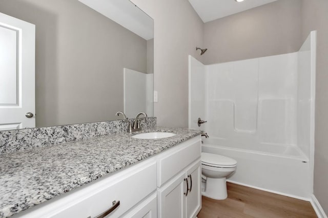 full bathroom featuring vanity, shower / bathing tub combination, wood-type flooring, and toilet