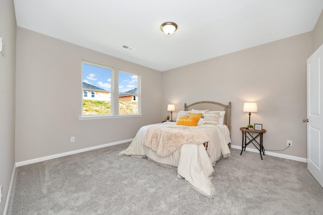 bedroom featuring light carpet