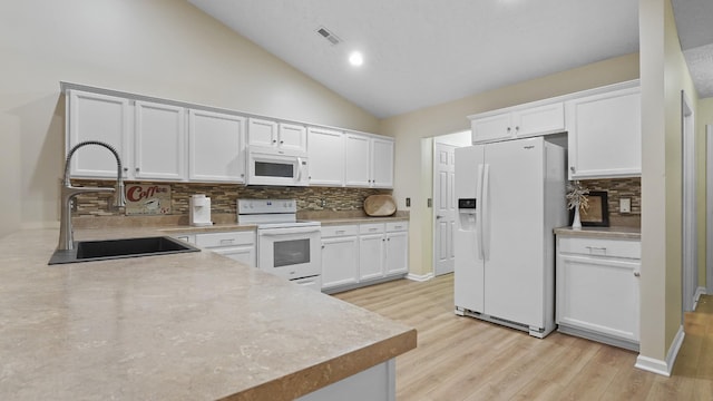 kitchen featuring white cabinets, white appliances, backsplash, and sink