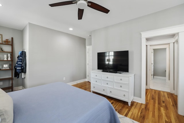 bedroom with wood-type flooring and ceiling fan