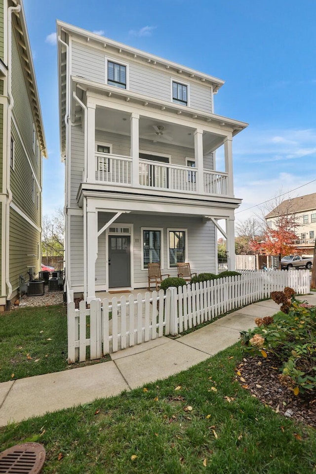 view of front facade with a balcony, cooling unit, and covered porch