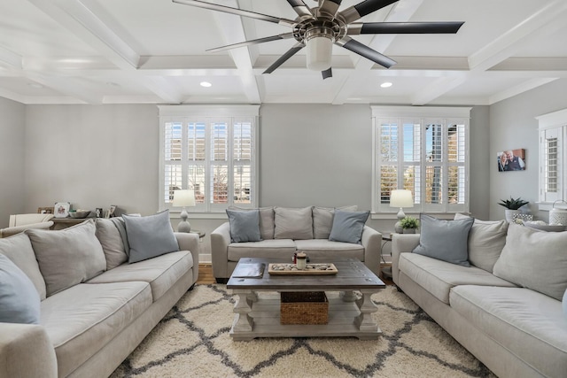 living room with ceiling fan, wood-type flooring, a wealth of natural light, and coffered ceiling