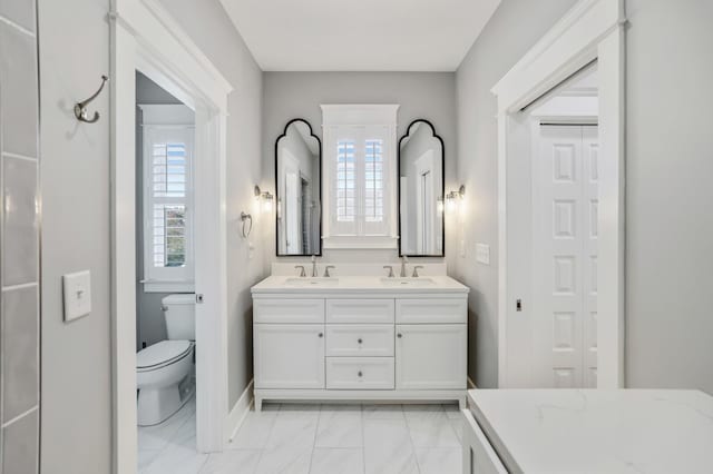 bathroom with vanity and toilet