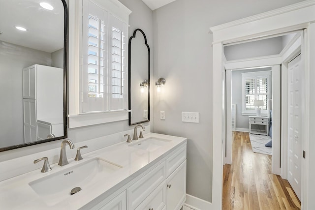 bathroom featuring hardwood / wood-style floors and vanity