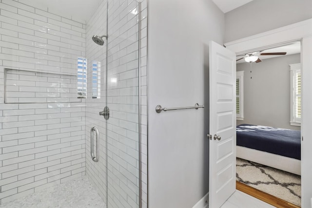 bathroom featuring wood-type flooring and an enclosed shower