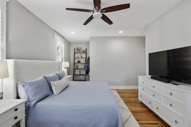 bedroom featuring ceiling fan and light hardwood / wood-style flooring