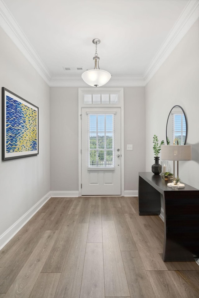 doorway to outside with crown molding and light hardwood / wood-style flooring