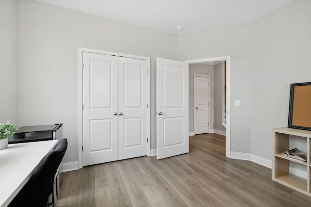 office with light wood-type flooring