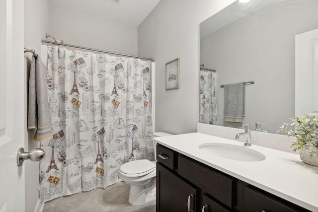 bathroom with curtained shower, tile patterned flooring, vanity, and toilet