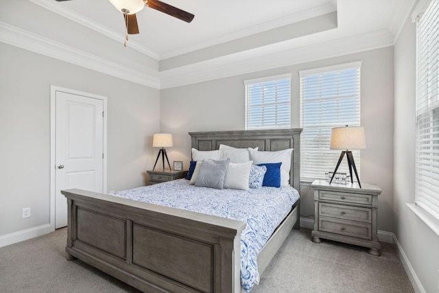 carpeted bedroom with ceiling fan and ornamental molding