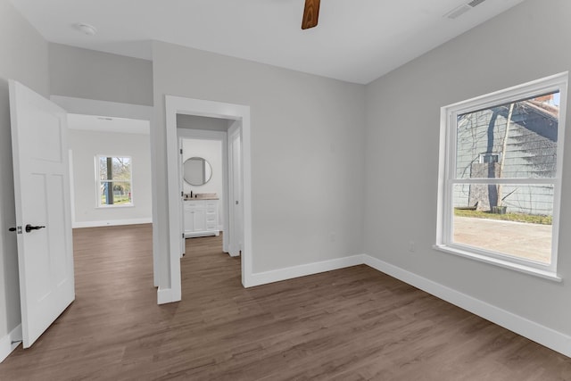 empty room featuring ceiling fan and wood-type flooring