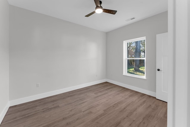 empty room featuring light hardwood / wood-style floors and ceiling fan