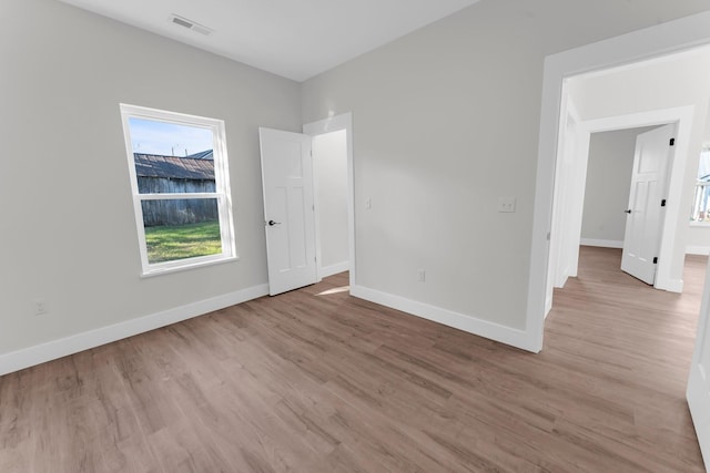 spare room with light wood-type flooring