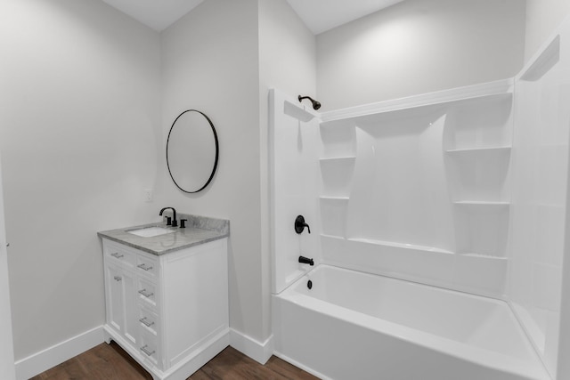 bathroom with vanity, shower / bath combination, and hardwood / wood-style floors