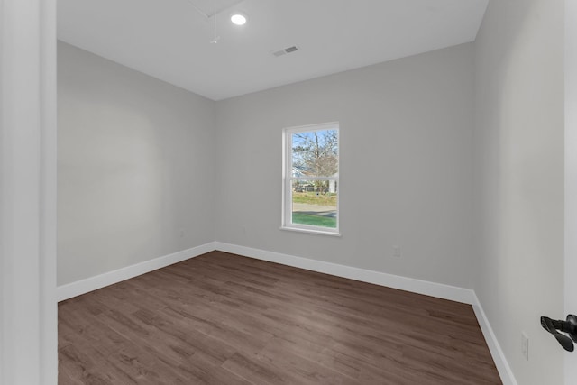 empty room with wood-type flooring