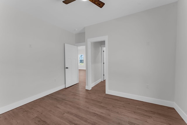 spare room featuring ceiling fan and light wood-type flooring