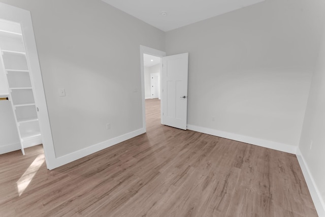 unfurnished room featuring light hardwood / wood-style flooring