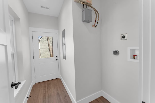 doorway with wood-type flooring