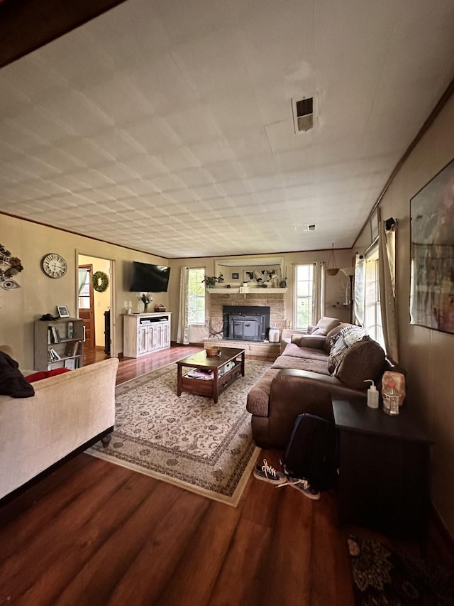 living room featuring a fireplace and hardwood / wood-style floors