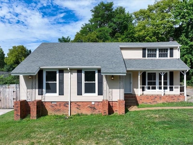 view of front of property with covered porch and a front yard