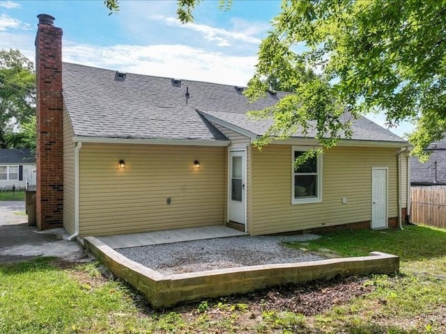 rear view of house featuring a patio