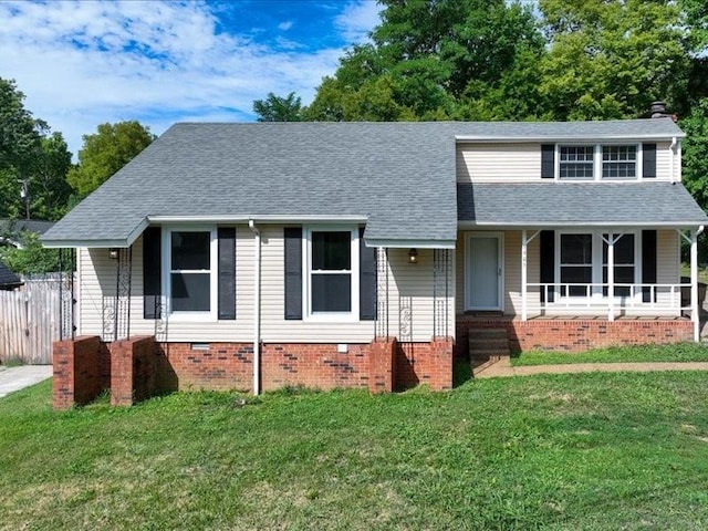 view of front facade with covered porch and a front lawn