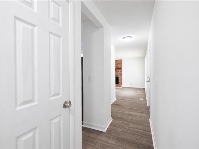 hallway featuring dark hardwood / wood-style flooring