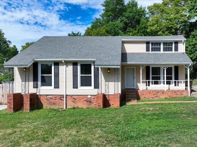 view of front of property featuring a front lawn and covered porch